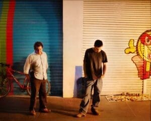 http://Men,%20night,%20group,%20standing,%20nightscene,%20market,%20viewers,%20metal%20fence,%20mexico%20city,%20mexico